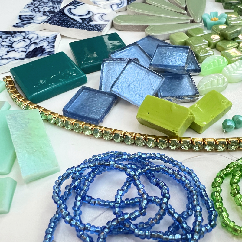 A mix of porcelain china, beads, glass, smalti, ceramic, brass, metal and whimsical mosaic materials.