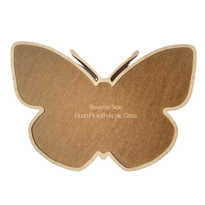 Reverse side of butterfly mosaic window frame with acrylic glass protectant layer.