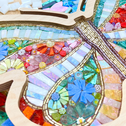 Colorful glass-on-glass mosaic art piece with glass flowers and wooden frame by Sharra Frank Mosaics.