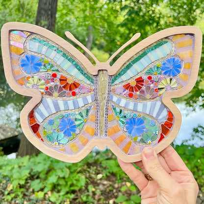 Colorful glass-on-glass mosaic art piece with glass flowers and wooden frame by Sharra Frank Mosaics.