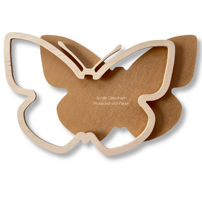 Butterfly-shaped wooden mosaic window frame on a white background for glass on glass mosaic technique.