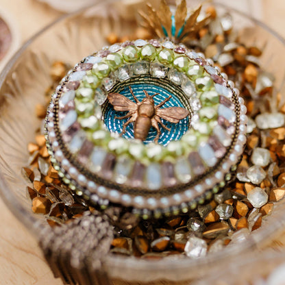 Beaded mosaic ornament with rhinestones, vintage findings and beads.