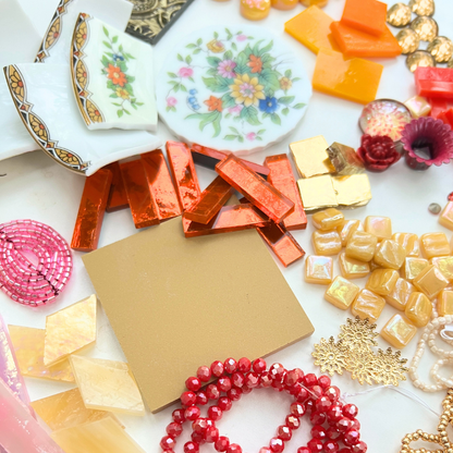 A mix of porcelain china, beads, glass, smalti, ceramic, brass, metal and whimsical mosaic materials.