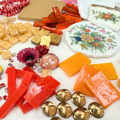 A mix of porcelain china, beads, glass, smalti, ceramic, brass, metal and whimsical mosaic materials.