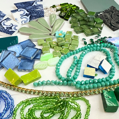 A mix of porcelain china, beads, glass, smalti, ceramic, brass, metal and whimsical mosaic materials.