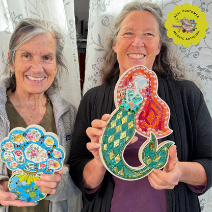 Two mosaic class students holding mosaic art pieces made in wooden mosaic frames.
