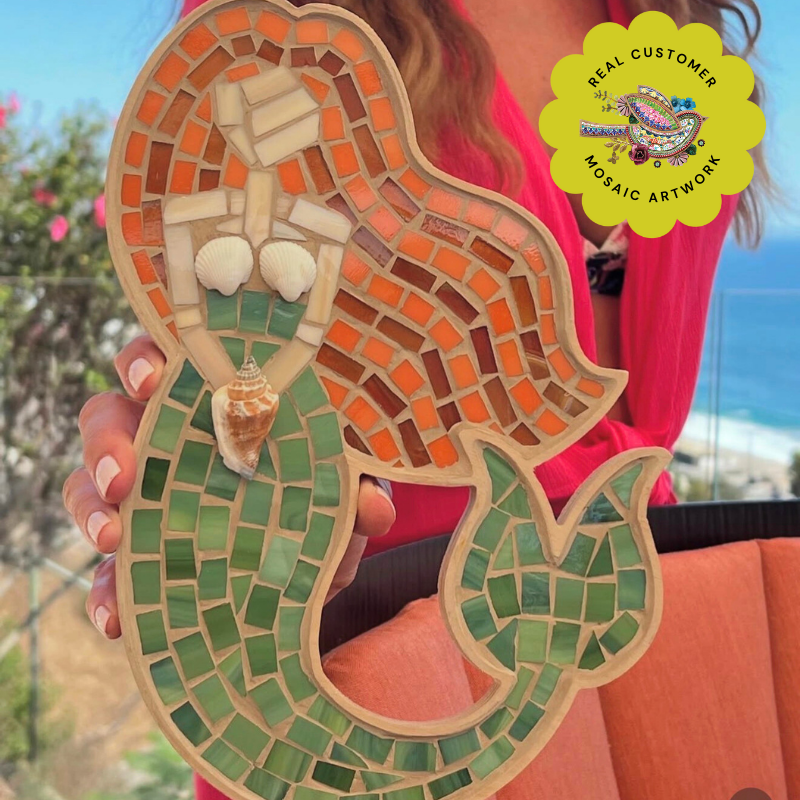 Wooden mermaid mosaic frame filled with glass and tile.