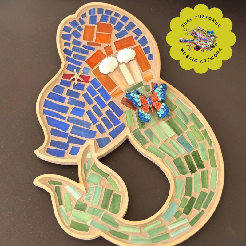 Mosaic artwork of a mermaid with blue, green, and orange tiles in a wooden mosaic frame template.