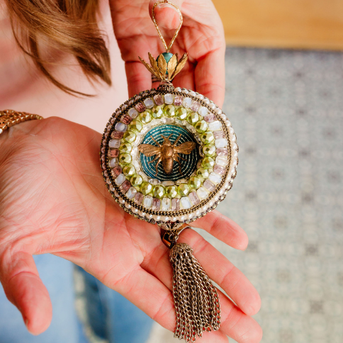 Beaded mosaic ornament with rhinestones, vintage findings and beads.