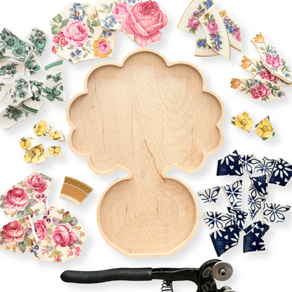 Wooden mosaic frame in the shape of a bouquet of flowers set into a vase. 