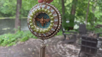 Beaded mosaic ornament with rhinestones, vintage findings and beads.