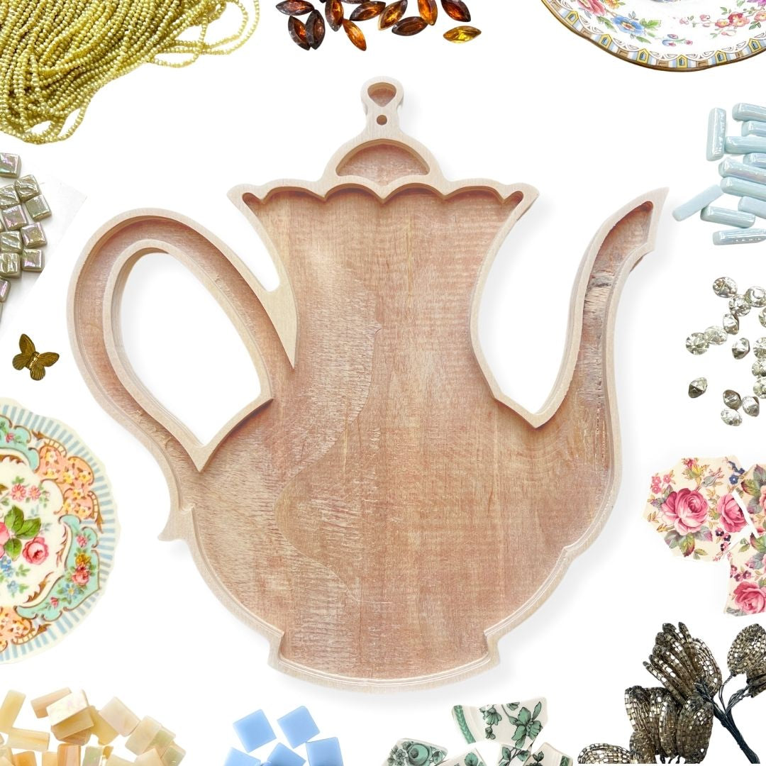 Wooden teapot shaped mosaic frame to fill with decorative elements such as tile, beads, stained glass and china.