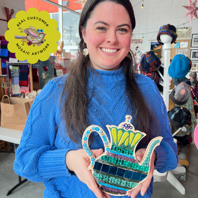 Mosaic art student with Mosaic Teapot Frame filled with stained glass, beads and tile.